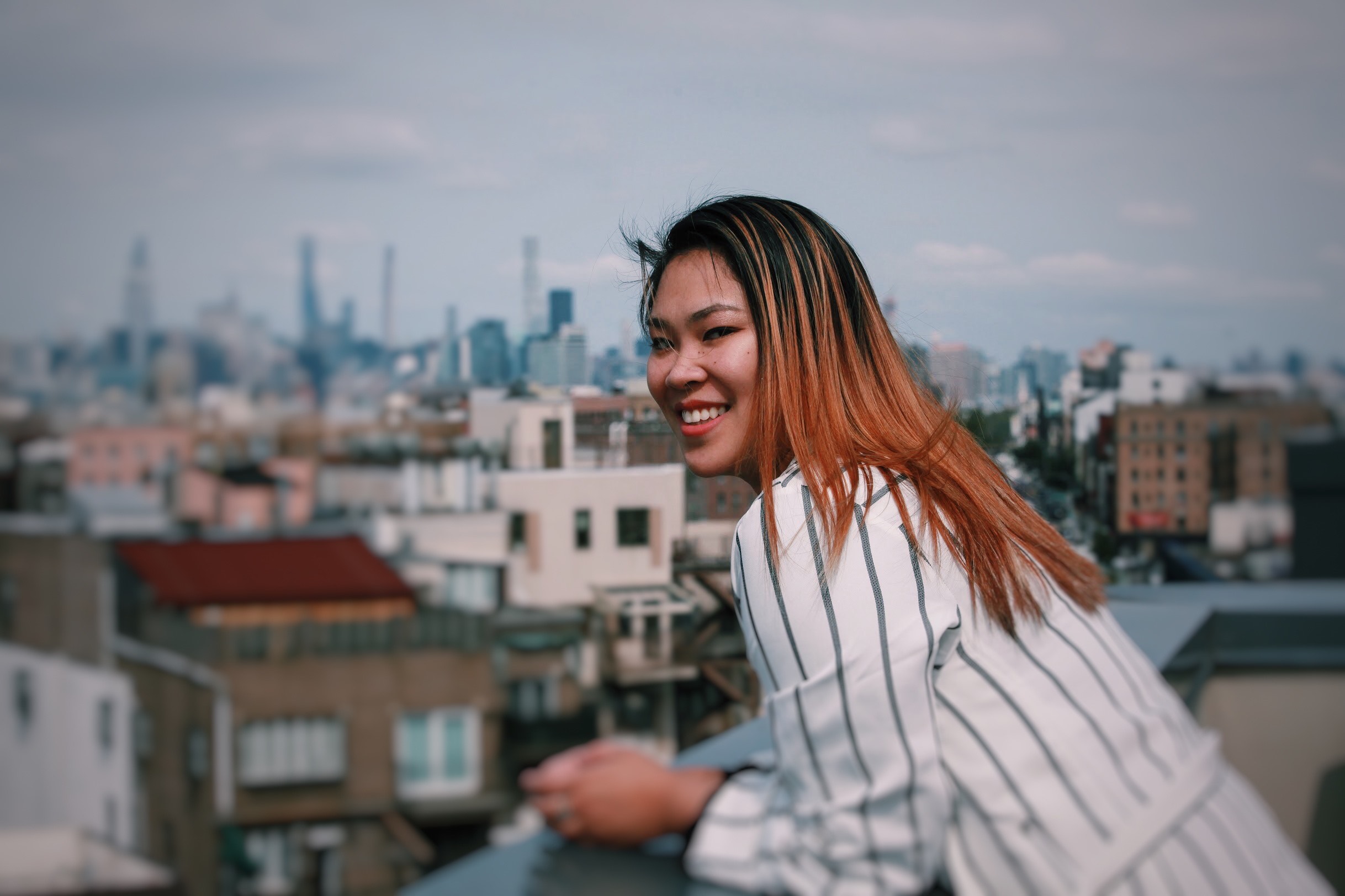 Agatha smiling on rooftop